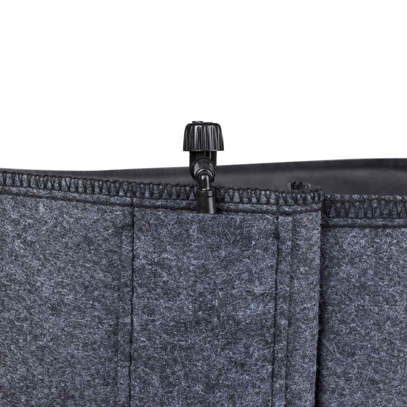 Felt plant grow bags with irrigation line holders.